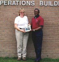 Grega St. John and Raymont Dentat the Operations Management International Inc. plant in Hinesville, Ga.